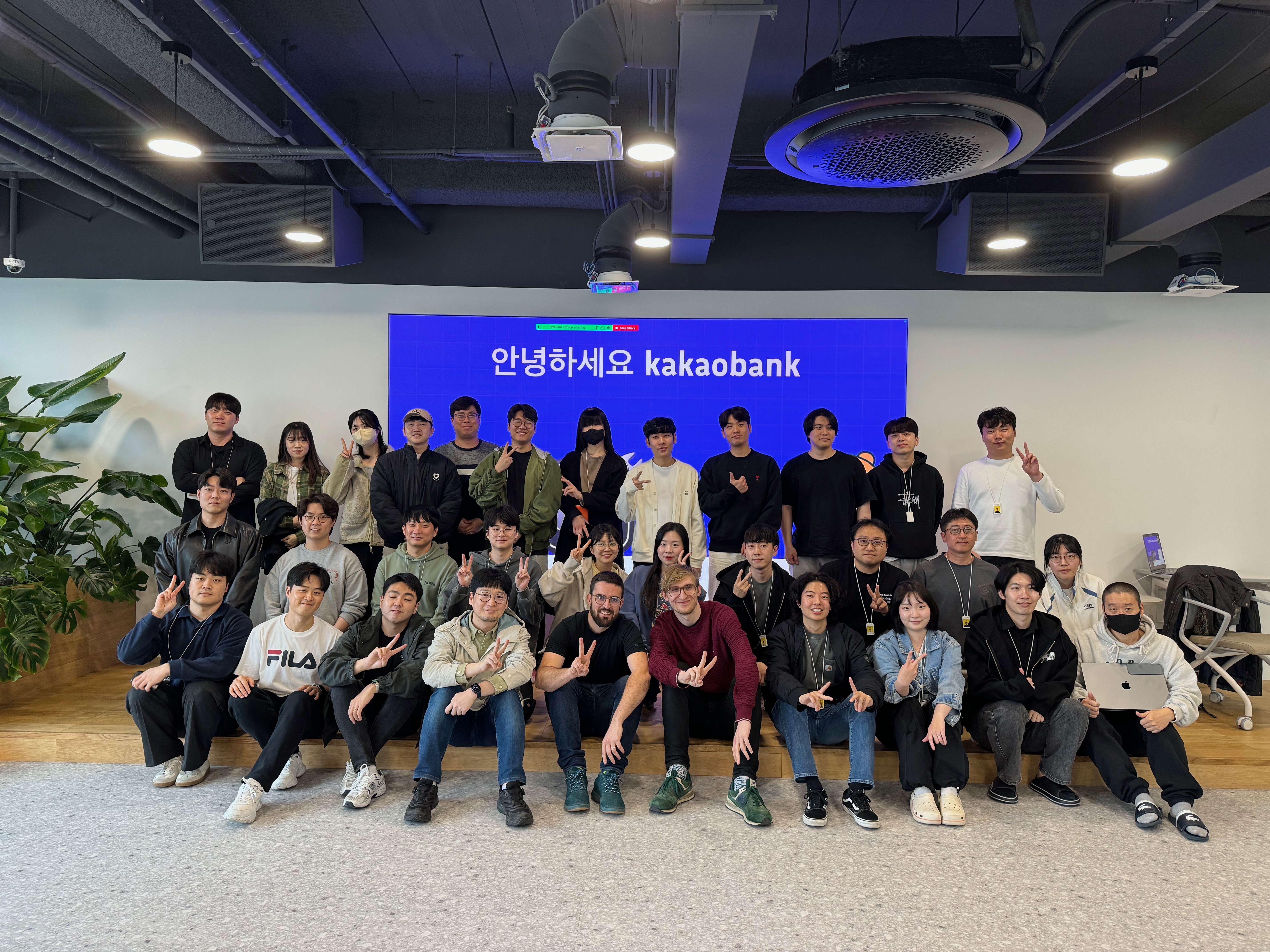 A photo of the team with attendees in the Kakao Bank offices in Seoul, South Korea