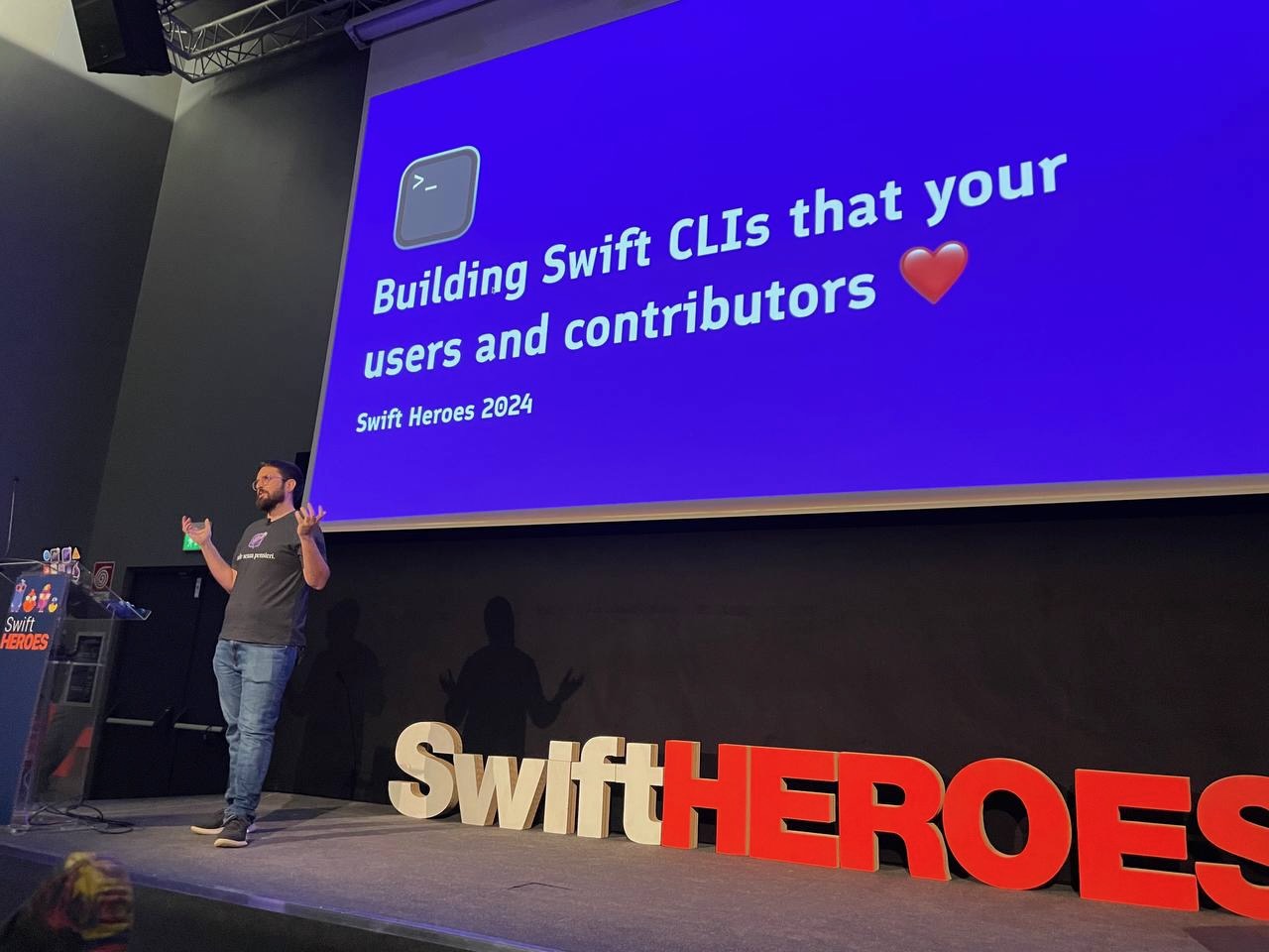 A photo of Pedro giving a talk at the Swift Heroes conference in 2024.