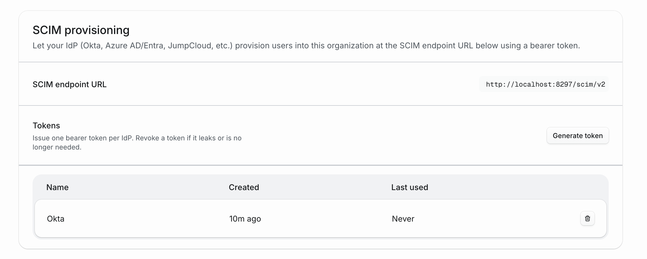 SCIM provisioning settings with the SCIM endpoint URL, token generation button, and token table